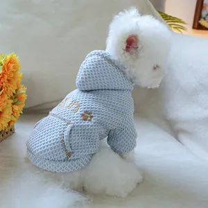Detailed view of light blue waffle knit dog hoodie featuring elegant COCO embroidery