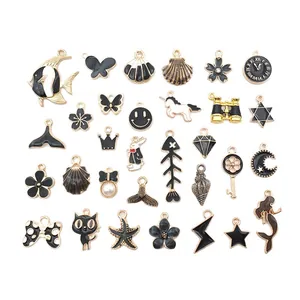 Colección de colgantes de esmalte negro y dorado para accesorios de bisutería DIY hechos a mano