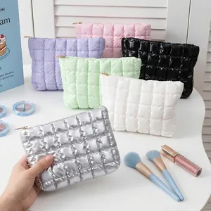 Collection of colorful portable bubble waffle grid makeup bags for cosmetic storage