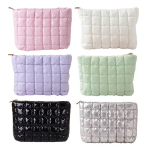 Portable puffy quilted makeup bags in multiple colors with waffle texture zipper