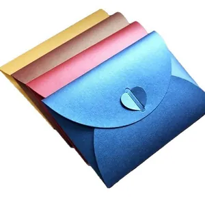 Close-up view of premium colorful pearlescent paper envelopes featuring a unique heart-shaped buckle