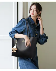 Stylish black large capacity commuter tote bag with kangaroo logo and mascot keychain accessory