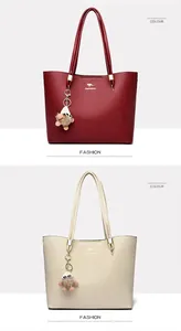 Detailed view of elegant large capacity tote bags in wine red and beige with kangaroo logo