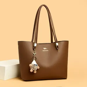 Simple large capacity brown faux leather tote bag for women with a cute decorative charm