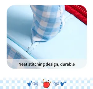Close-up of neat white stitching on a light blue leather cosmetic bag material detail