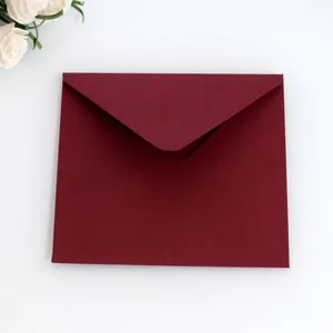 Elegant dark burgundy pearlescent paper envelope for holiday greeting cards and invitations