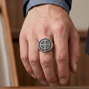 Detail view of a vintage Saint Benedict cross signet ring for men in stainless steel