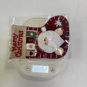 Close-up view of a 3D Santa Claus Christmas stocking on a digital scale showing weight