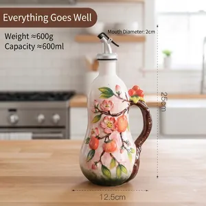 Detailed view of hand-painted ceramic oil dispenser with persimmon pattern and dimensions