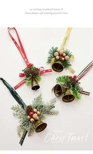 Detailed view of festive Christmas bell ornaments with pine cones and ribbons