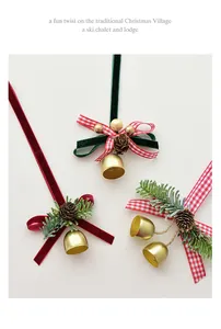 Close-up of Christmas ornaments with gold bells, pine cones, and velvet bows