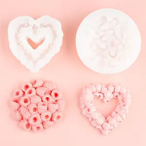 Detailed view of raspberry heart and circle silicone molds for DIY soap and cake making