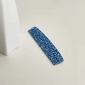 Mini blue and white patterned acetate hair comb with wide teeth for anti-static use