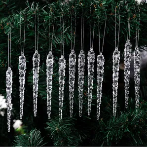 Detailed view of 12 transparent acrylic icicle ornaments hanging on green Christmas tree branches
