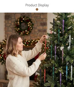 Decorative colorful acrylic icicle ornaments hanging on a festive green Christmas tree
