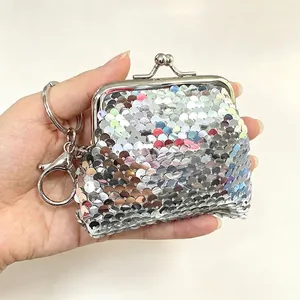 Silver sequin coin purse featuring a sturdy kiss-lock metal frame and a handy keychain