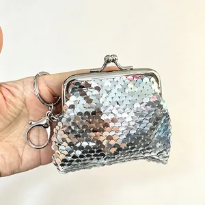 Detail of silver sequin mini coin purse with metal clasp and keychain attachment