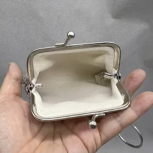 Interior view of a mini silver sequin coin purse with vintage metal clasp