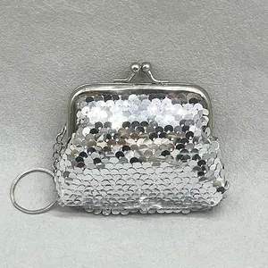 Detail of silver sequin mini coin purse with kiss-lock clasp and keychain ring