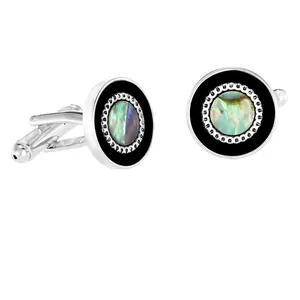 Close-up of men's silver cufflinks featuring natural abalone shell and black enamel inlay.