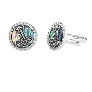 Detail of Viking Mjolnir cufflinks with colorful abalone shell inlay for men.