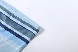 Macro detail shot of blue horizontal striped mesh fabric with high-quality seam work
