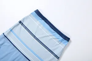 Macro view of blue striped mesh fabric detail with elasticated waistband and stitching.