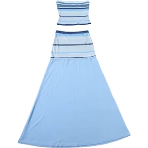 Two-piece set with striped tube top and mesh semi-transparent light blue maxi skirt