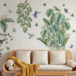 Realistic tropical monstera and butterfly wall stickers displayed above a modern sofa