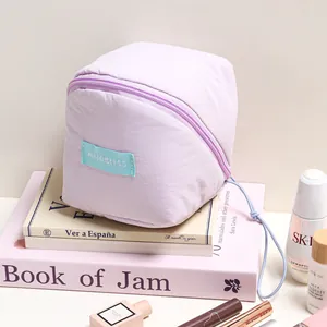 A stylish macaron purple cloud makeup bag featuring large capacity and portable design