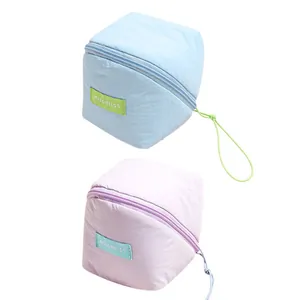 Pastel blue and lilac macaron cloud makeup bag with soft texture and logo label
