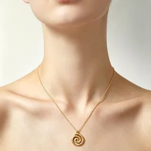 Elegant gold spiral swirl pendant necklace for women's minimalist and retro jewelry style