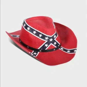 Detail view of a vintage red cowboy hat featuring a blue and white star cross pattern design