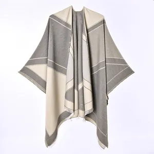 Detailed view of cashmere-like open front shawl with geometric color-blocking