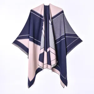 Soft women's reversible faux cashmere cloak shawl featuring geometric color-block pattern
