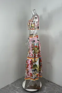 Side view of vibrant architectural print crop top and tiered maxi skirt set on mannequin