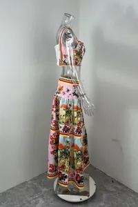 Side view of vibrant floral and architectural print crop top and maxi skirt fashion set.