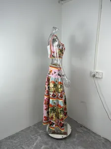 Side view of a floral print crop top and high-waisted tiered skirt set on mannequin.