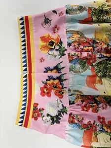 Close-up detail of high-waisted floral skirt with vibrant colorful print and zipper