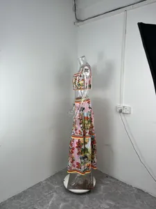 Side view of floral printed summer two-piece set with crop top and tiered skirt