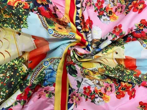 Detail view of vibrant floral and scenic print fabric with smooth satin texture and bright colors