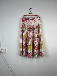 Detailed view of bohemian floral maxi skirt featuring Roman column prints and tiered ruffles