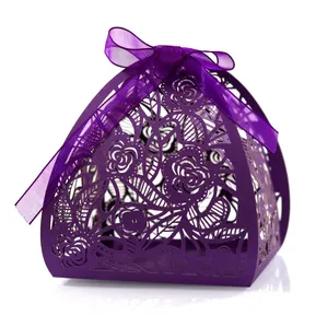 Elegant purple laser-cut candy box featuring floral rose patterns and a satin ribbon bow