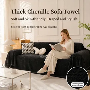 Close-up detail showing the black herringbone pattern fabric on a chenille sofa cover