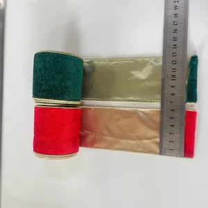 Close-up of 6cm velvet ribbon with gold wired edges in festive red and green colors.