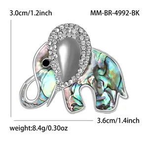 Elegant silver-tone elephant brooch featuring sparkling rhinestones and colorful abalone shell