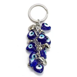 Llavero protector de corazón azul mal de ojo con dijes de corazón de plata aleada