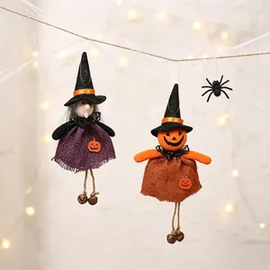 Detailed view of Halloween burlap hanging dolls with pumpkin and witch designs and tiny bells.