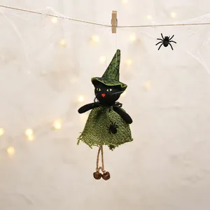Detailed shot of a Halloween black cat witch doll hanging with spooky cobweb decor