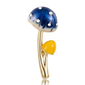 Niedliche Pilzbrosche mit blauem und gelbem Emaille-Finish auf goldener Legierung